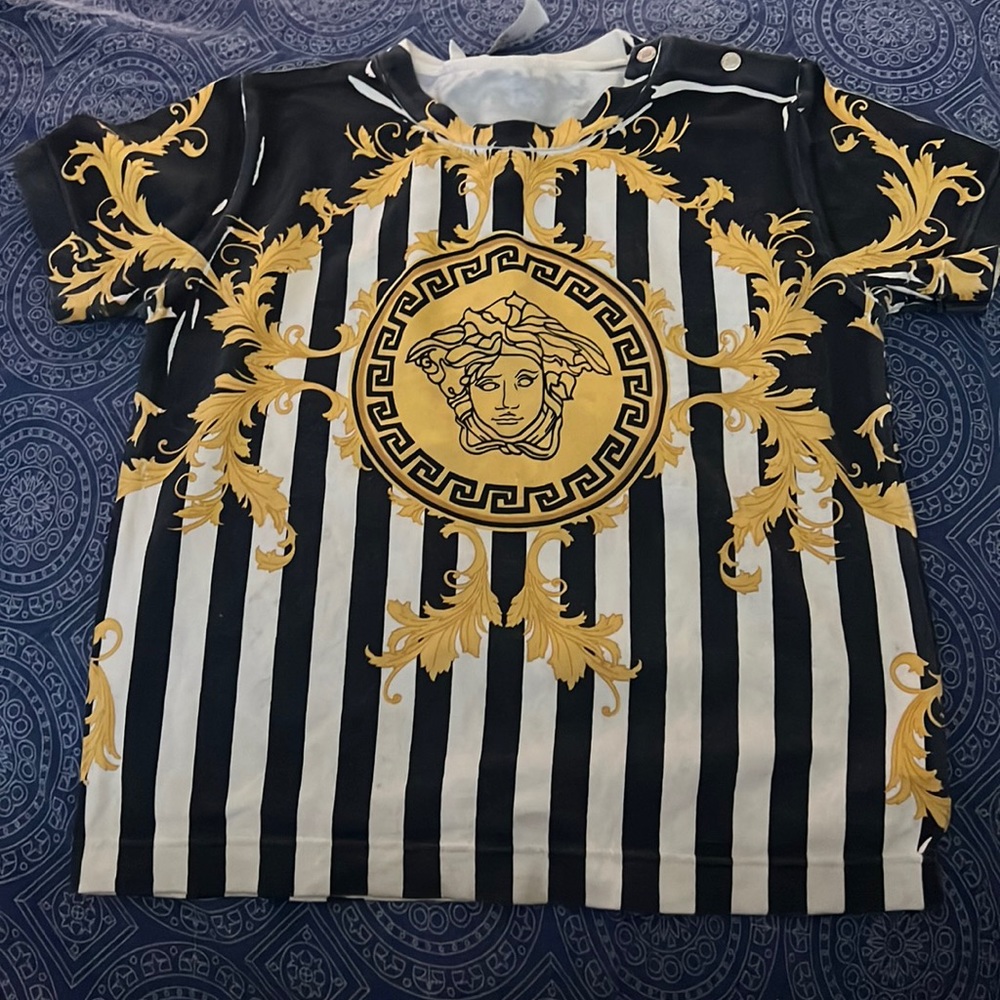 Authentic versace top. Worn once! Great condition. Size 24 months.
